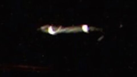 An unidentified flying object passing by the International Space Station. Aliens?