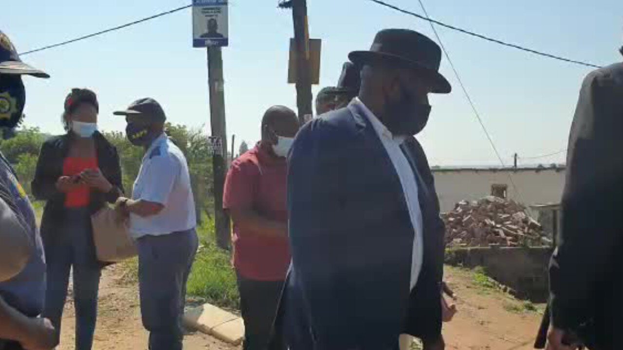 Cele speaks to a shopkeeper at the scene of the crime where an EFF candidate was gunned down (1)