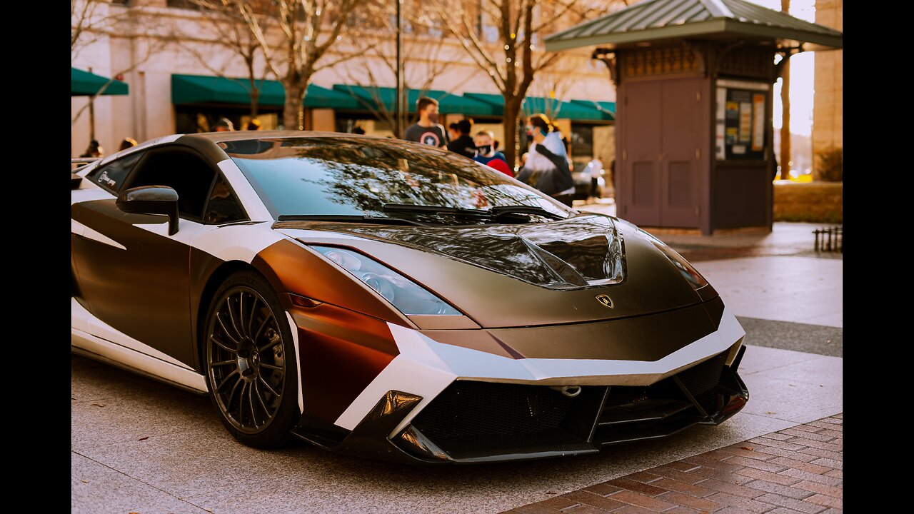 lamborghini in front of burj al arab in dubai beach