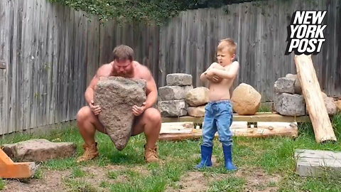 Caveman workout: Father and son lift rocks together