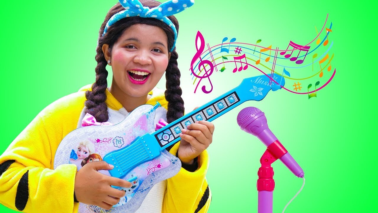 Linda Plays with Disney Frozen Toy Guitar and Starts a Band