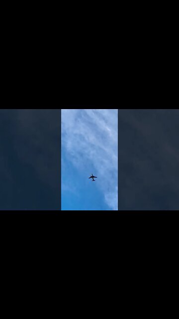An airplane flying through the sky