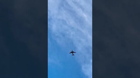 An airplane flying through the sky