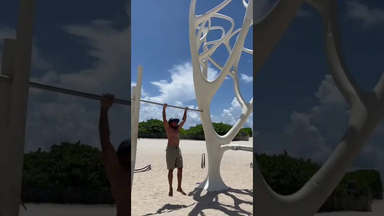 Pull-up bar workouts at Muscle Beach South Beach, Miami Beach, Florida