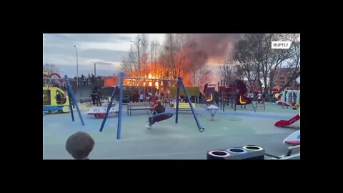 A high-profile video of Russian children calmly rocking by a large building