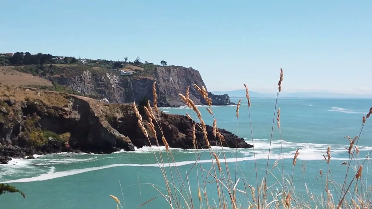 calming waves crashing on cliff rocks