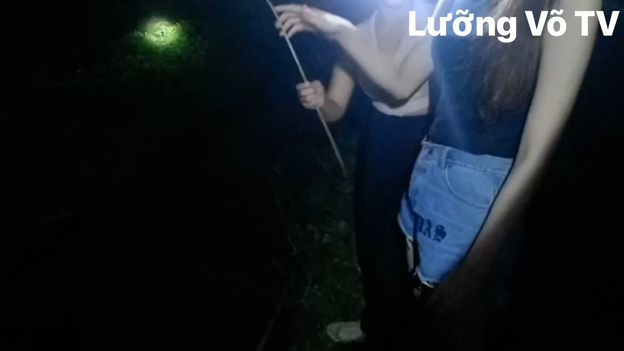 Asian girls go fishing at night time