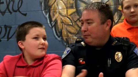 Officer adopts boy he rescued