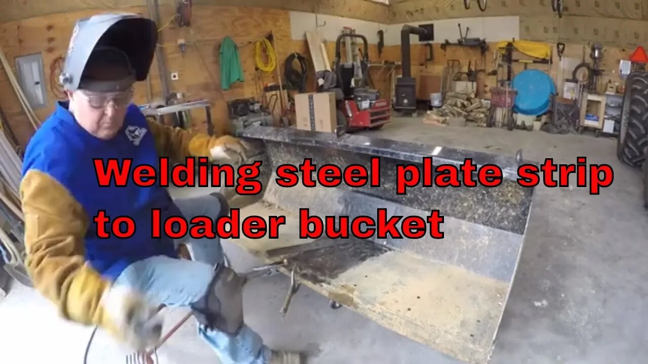 Welding steel plate to loader bucket