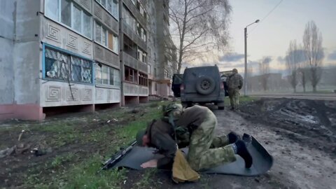 A Russian FSVNG soldier from the Chechen Republic prays between battles in Mariupol