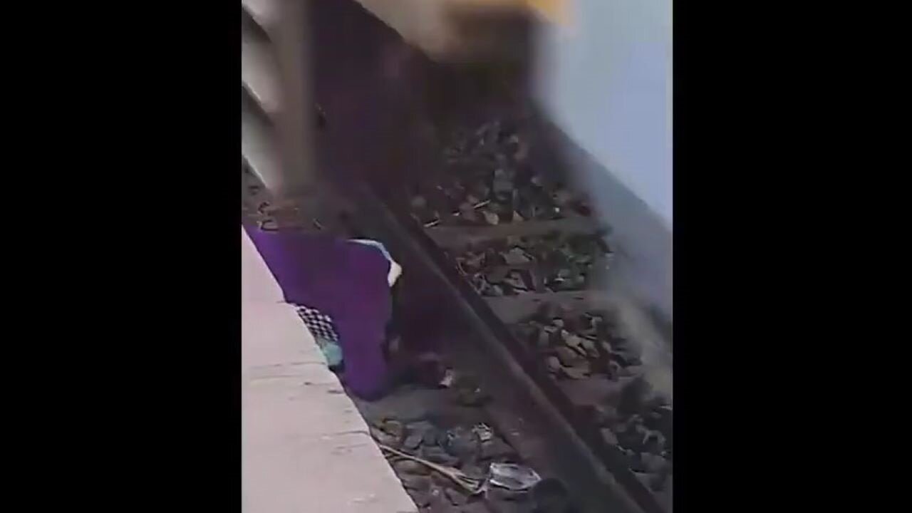 Mom Saving Her Children Who Fell On Train Tracks Using Her Body To Shield Them As Train Speeds Over