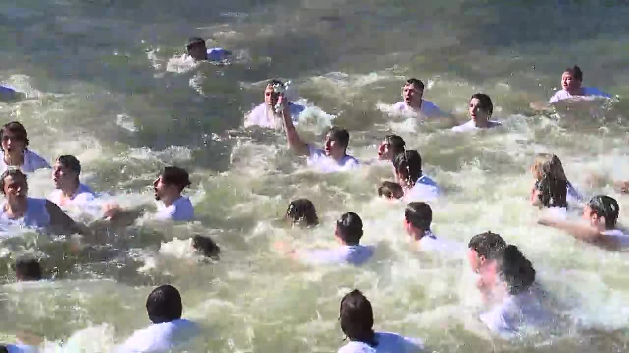 Teen grabs cross thrown into Spring Bayou on Epiphany