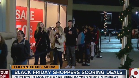 Shoppers up bright and early at Monroe outlets