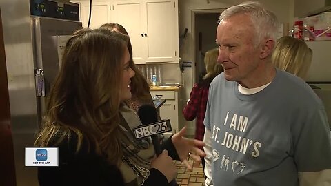 Volunteers work to serve breakfast at local shelter