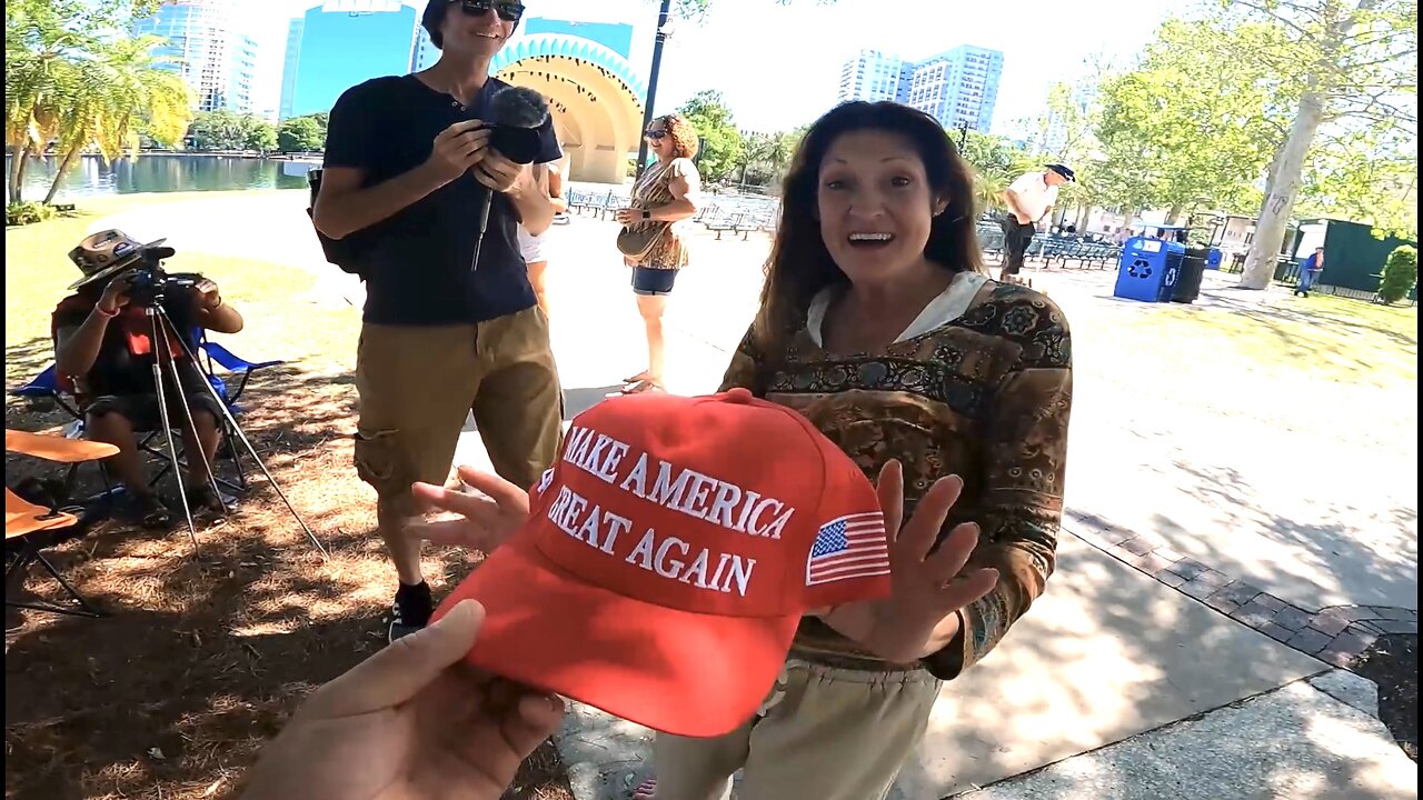 Passing out MAGA hats Lake Eola Orlando