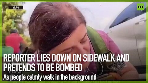 Reporter lies down on sidewalk and pretends to be bombed