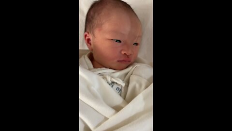 A baby looking to the side
