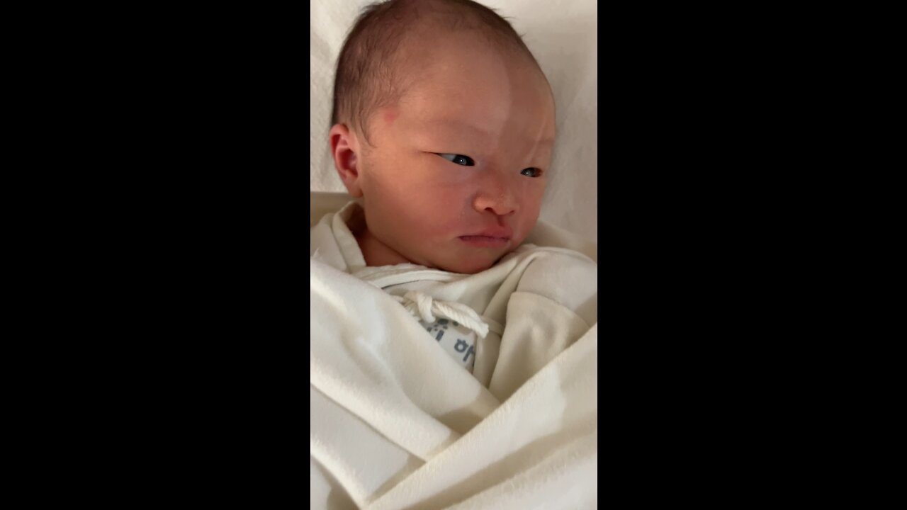 A baby looking to the side