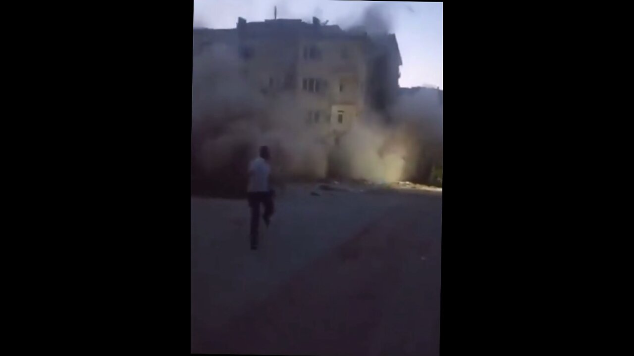 dudes throw rocks at building on verge of collapse- run!.