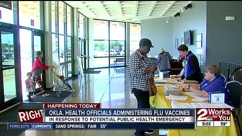 Health officials administering flu vaccine