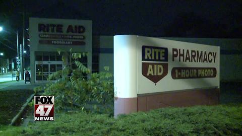Lansing pharmacy robbed at gunpoint