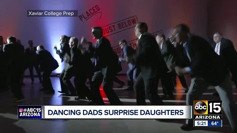 Dancing dads surprise daughters at Xavier College Prep dance