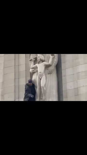 Someone has climbed onto the BBC building and smashing up the Eric Gill pedo statue