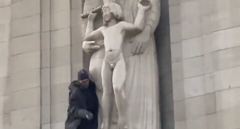 Someone has climbed onto the BBC building and smashing up the Eric Gill pedo statue