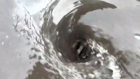 Unclogging storm drain. Multiple whirlpools. In the spirit of-3