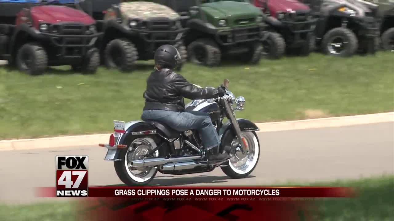 Bikers warn people of grass clippings