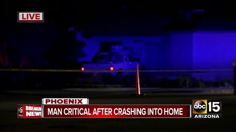 Man seriously hurt after crashing into Phoenix home