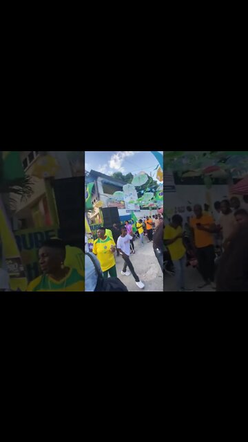 Haitianos comemorando a vitória do Brasil sobre a Sérvia na Copa do Mundo.