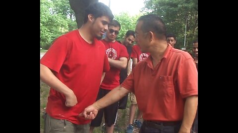Luodong Chi Checks Young Man In Red Shirt At The Park With The Boys