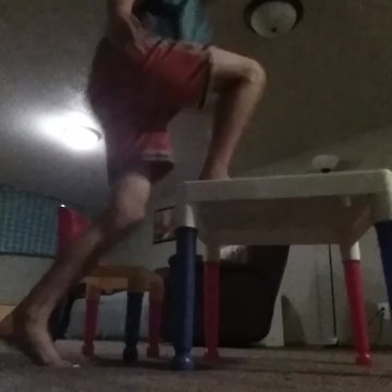 A Boy Climbs On A Toy Desk And It Breaks Under Him