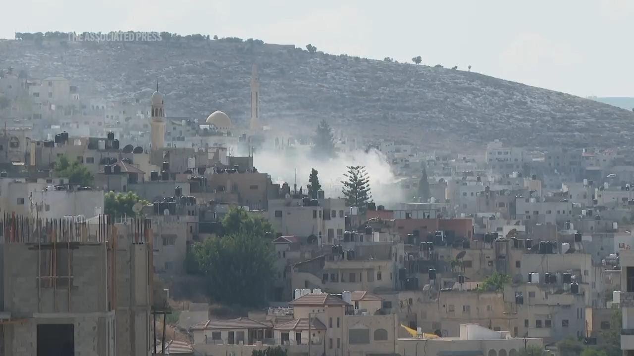 Smoke rises over Jenin as Israeli military raid into West Bank goes on