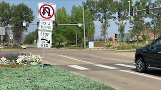 Why do drivers around Flatirons mall pull their car onto or beyond the crosswalk?