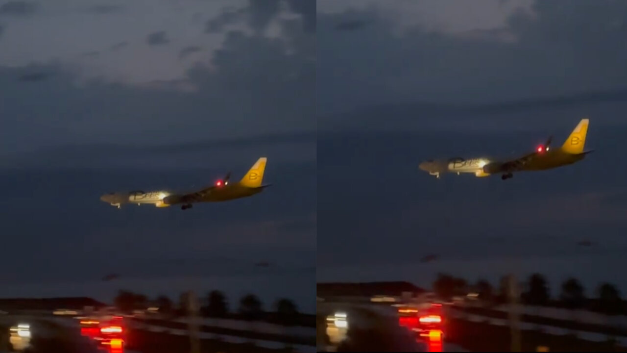 The airport is over the water and the plane landing at night is more beautiful