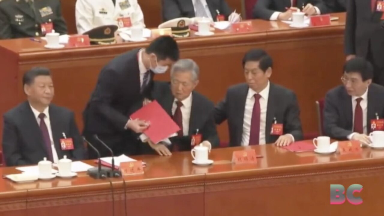 Former Chinese leader Hu Jintao unexpectedly led out of room as Party Congress comes to a close