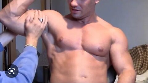 Fit guy flexing MUSCLES