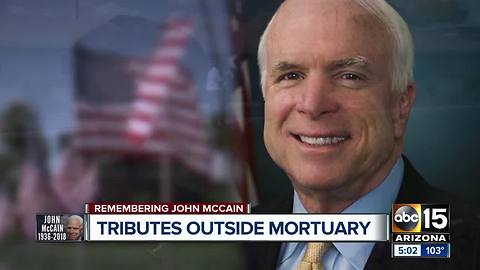 Tributes and mementos left outside Phoenix mortuary honoring John McCain