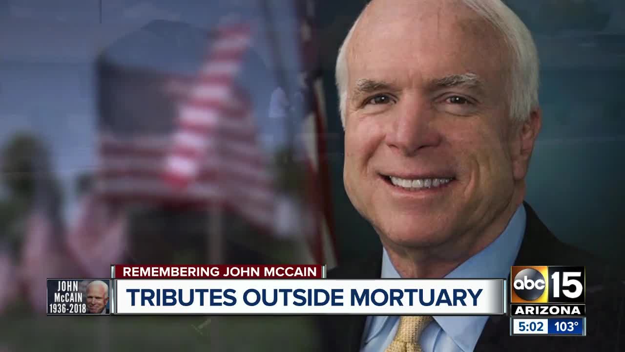 Tributes and mementos left outside Phoenix mortuary honoring John McCain