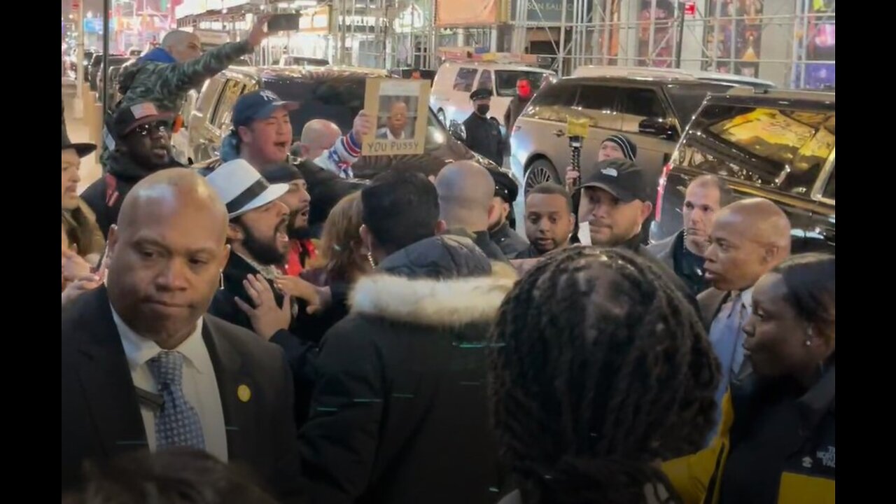 NYC Mayor Eric Adams surrounded by protesters against mandates at Times Square restaurant - 4/6/2022