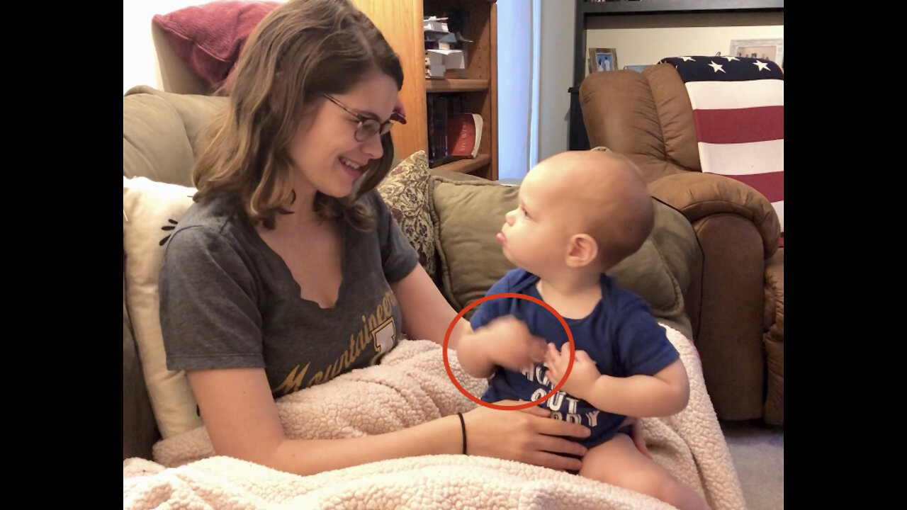 Baby using sign language to ask for another song