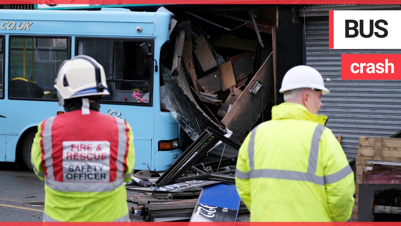 A single-decker school bus had a close shave when it crashed into a barber shop