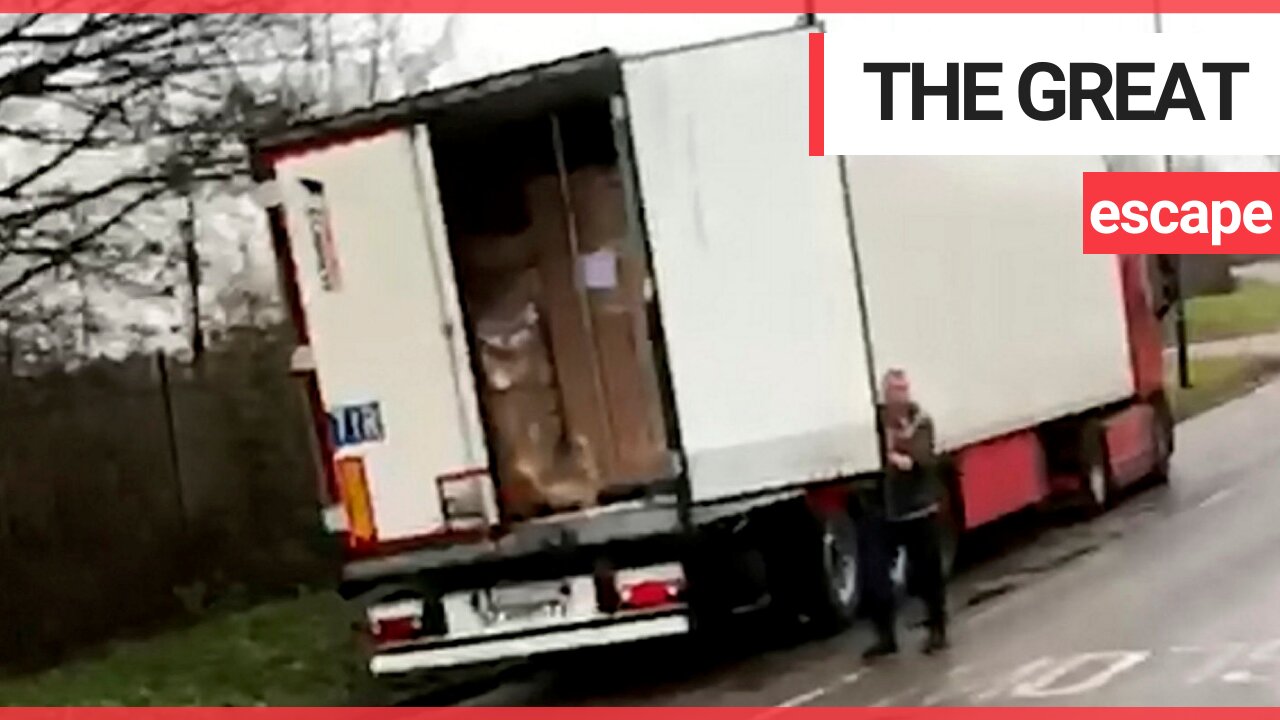 A group of men are seen running away after jumping out the back of a lorry