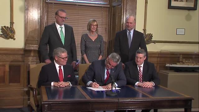 Gov. Eric Holcomb makes dreams come true, signs bill to allow Sunday alcohol sales