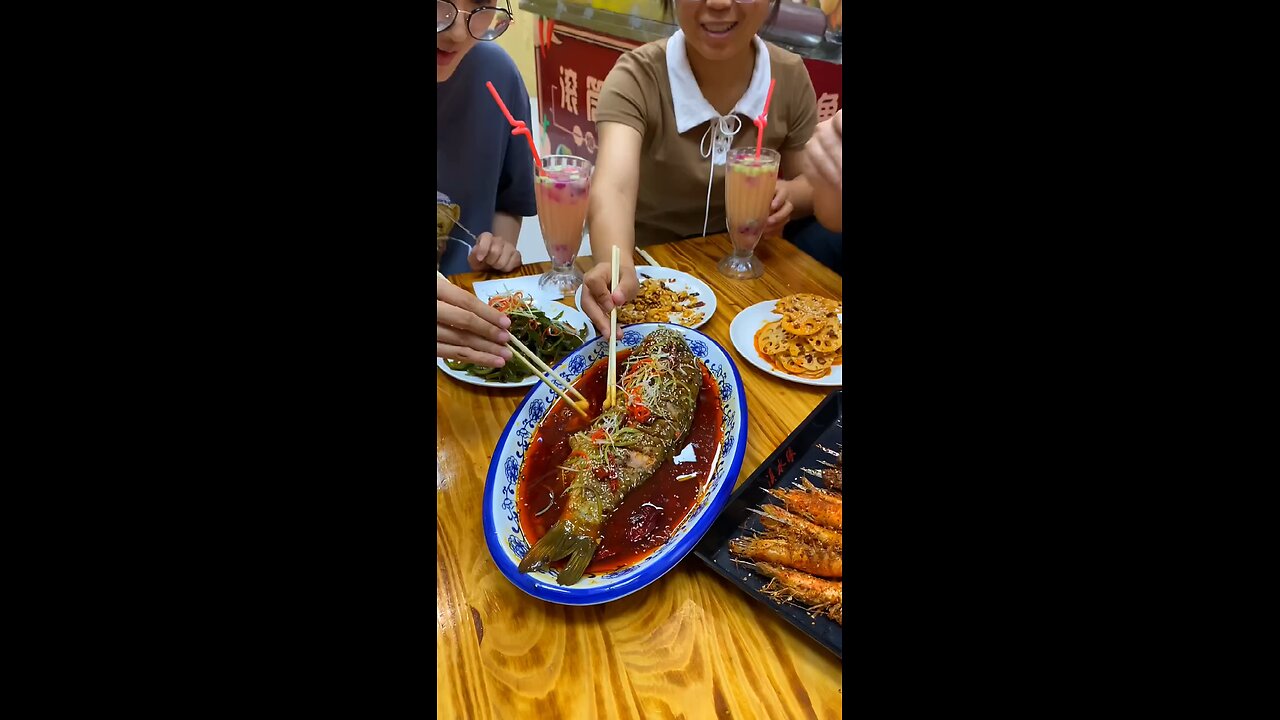 Delicious Chinese food Grilled Fish in Iron Bucket