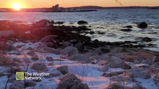 The sunset sets the coast aglow on a clear winter evening