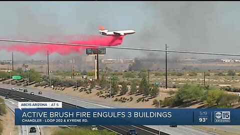 Active fire engulfs three buildings near busy Valley freeway