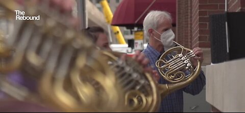 With stages shuttered, orchestras move to street corner performances
